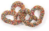 Milk chocolate pretzels covered in rainbow nonpareil seeds
