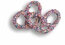 White chocolate pretzels covered in rainbow nonpareil seeds